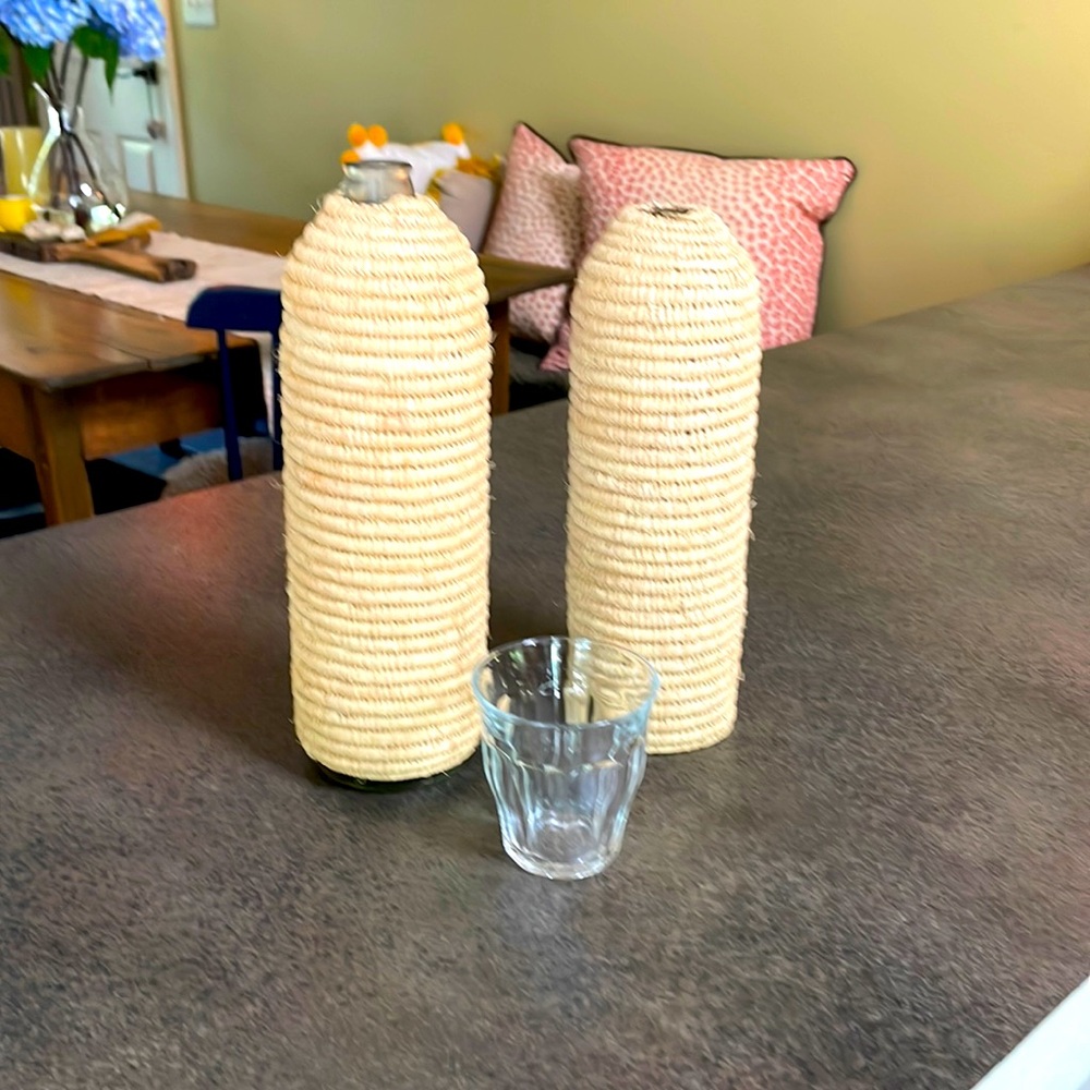 2 Basket woven water bottle covers - bought in France. Beautiful summer addition